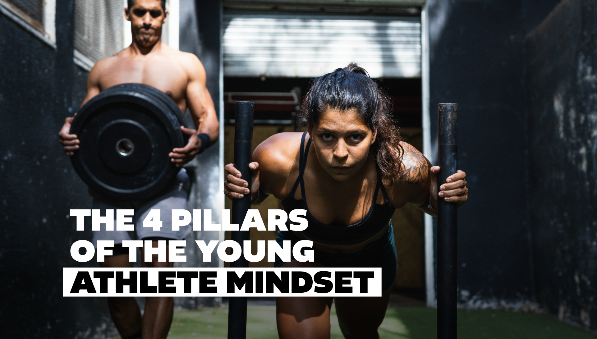 woman and man working out together pushing a sled